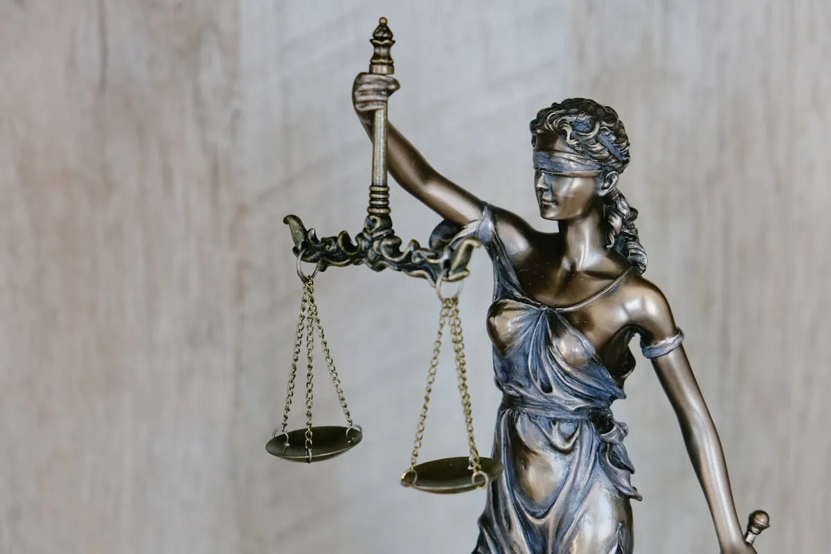 Lady Justice statue holding scales symbolizing law and legal services