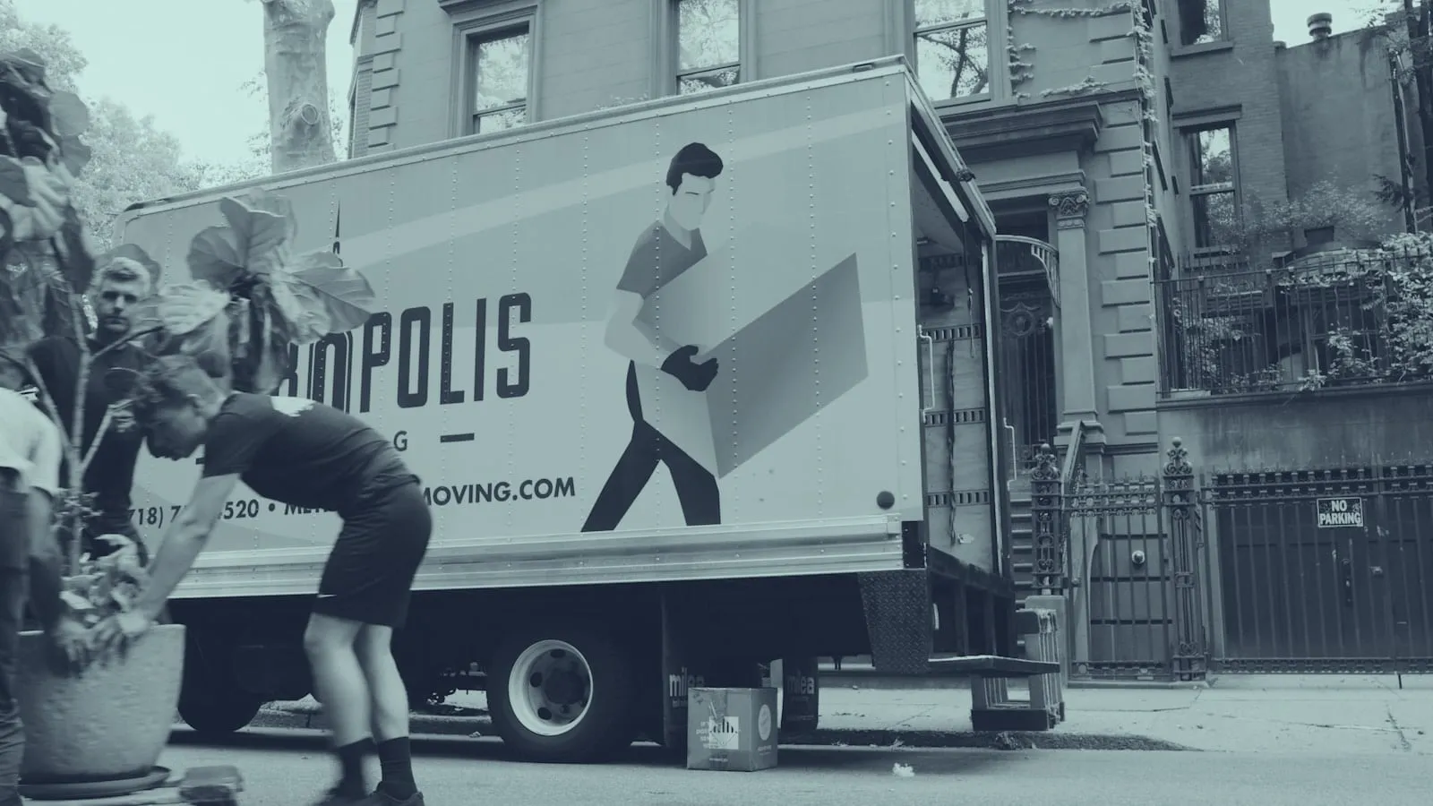 Professional movers loading furniture into a moving truck
