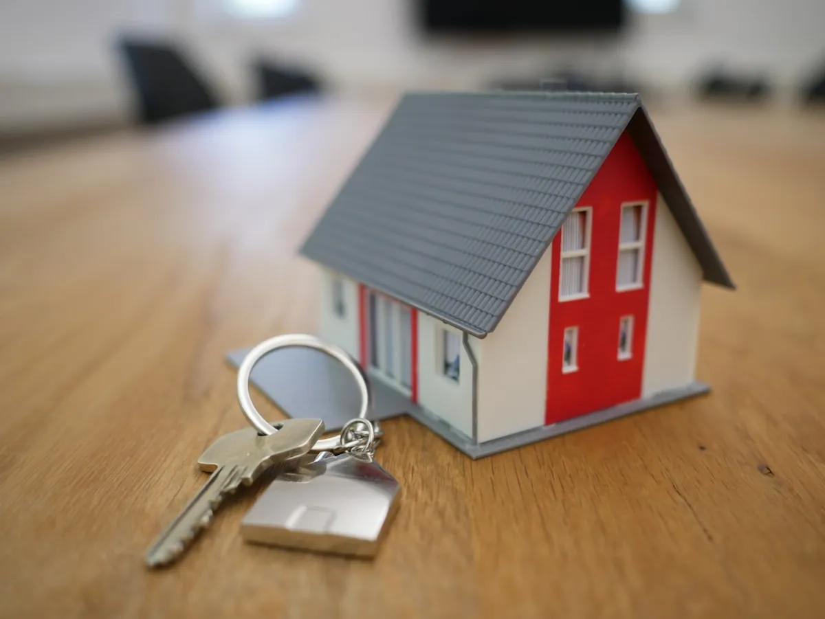 House model with keys representing real estate property sales