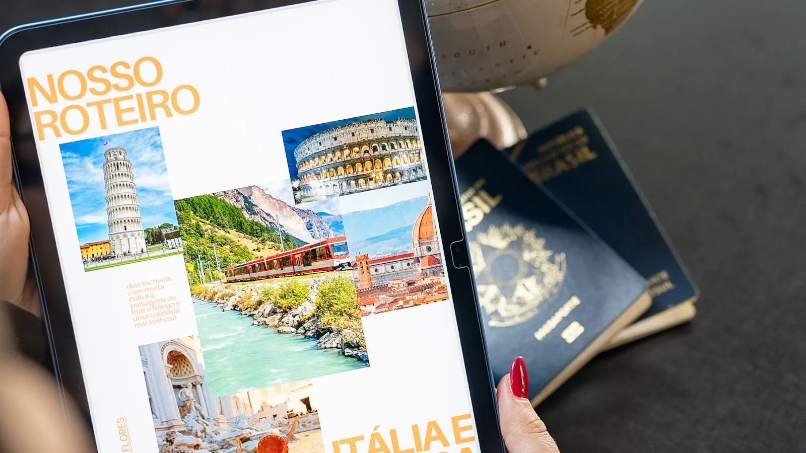 Travel planning workspace with globe, tablet, passports, and itinerary details